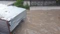 В Симферополе дождём смыло в реку строительный вагончик с человеком