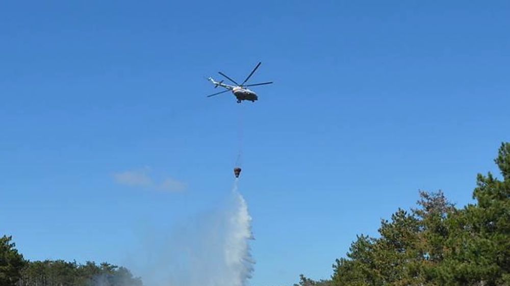 Два вертолета задействуют для тушения пожара на складе боеприпасов в Джанкойском районе Крыма