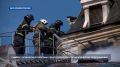 Кадры работы пожарных у здания Панорамы после атаки ВСУ