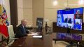 Владимир Путин по видеосвязи провел оперативное совещание с членами Совета Безопасности